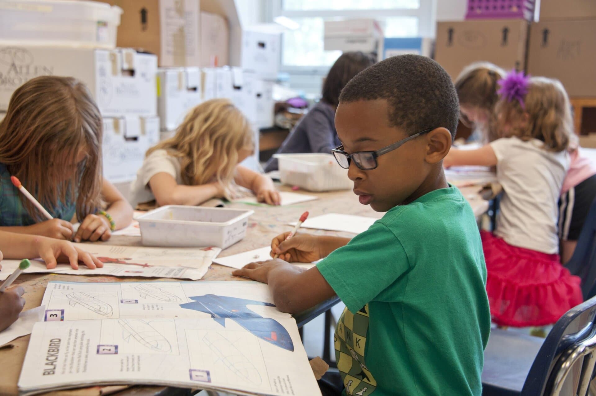 Children doing schoolwork at desks