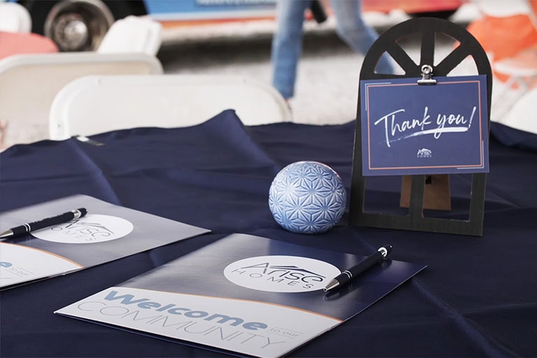 Arise Homes Welcome Packet Community Event Table