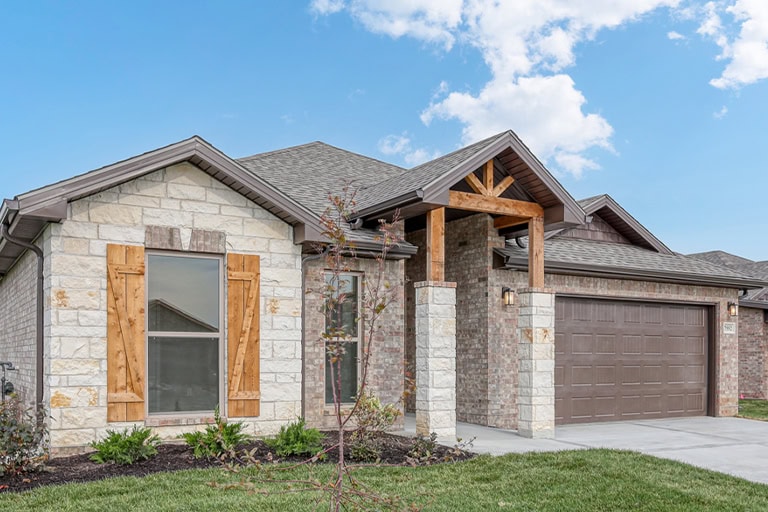 Modern Stone Brick Home Exterior Wood Accents