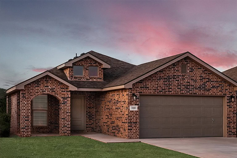 Brick Single Story House With Two Car Garage Sunset3