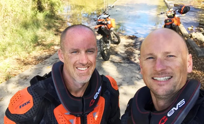 Two Men With Dirt Bikes Outdoor